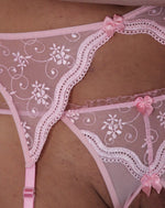 Load image into Gallery viewer, Close up of femme pink lace thong and suspender worn by a man. Moot lingerie for men. 
