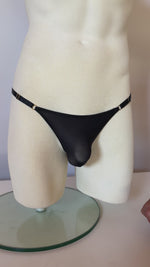 Load and play video in Gallery viewer, Mannequin showing the mesh tanga knickers for men, lingerie for men, mens lingerie, sexy knickers, sexy black panties for him, can men wear lingerie?, sexy underwear for men, best panties for men, men&#39;s cute panties, soft black panties for him, strappy black sexy panties for men, trans panties, trans friendly lingerie

