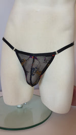 Load and play video in Gallery viewer, Mannequin showing floral thong for men, lingerie for men, mens lingerie, sexy underwear for men. 

