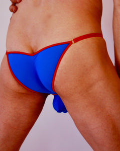 Rear view of tiny red and blue briefs for men. Buttock hugging underwear for men. Men's lingerie by Moot. Sexy tight pants for men.